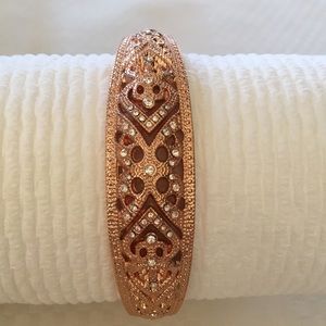 Rose gold clear stone hinged bracelet.